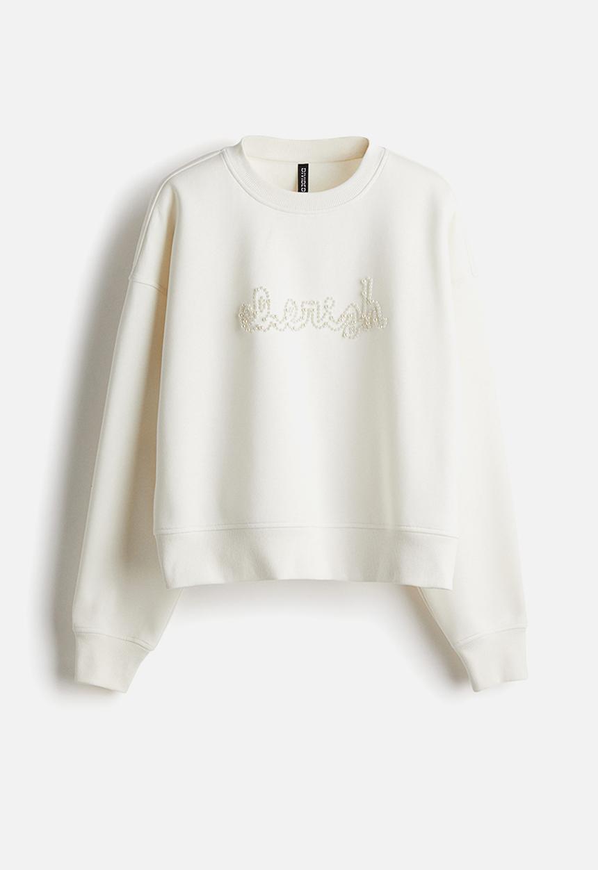 H&M - Oversized embellished sweatshirt - cream cherish