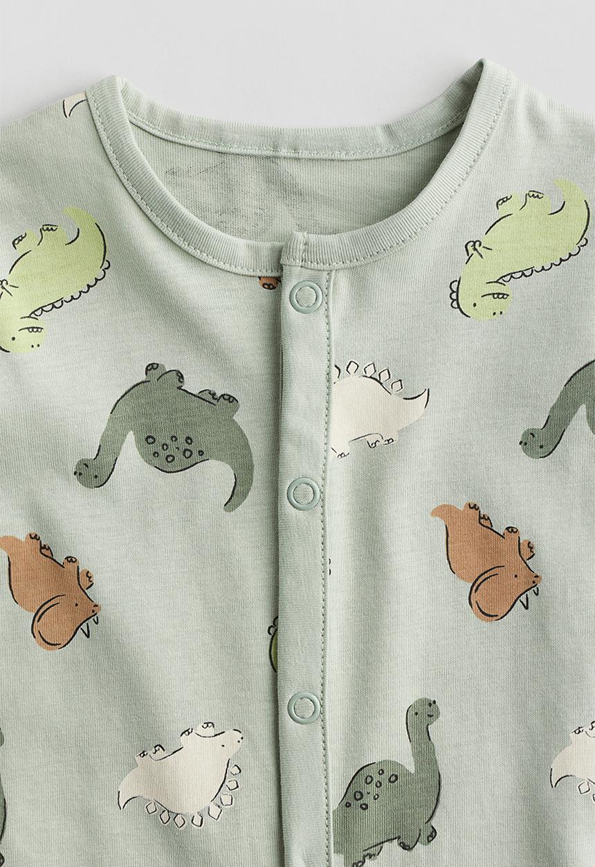 H&M - Patterned sleepsuit -  light dusty green/dinosaurs 