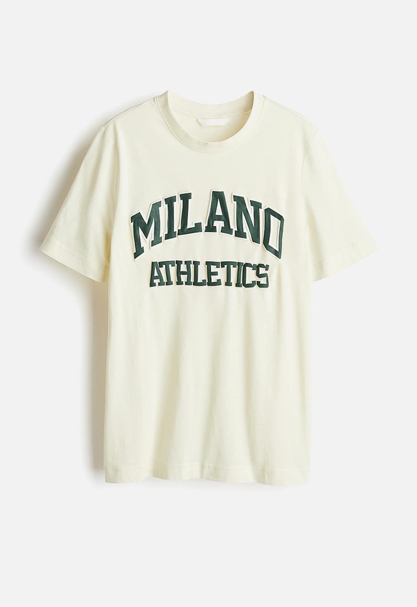 H&M - T-shirt - pale yellow & milano athletics