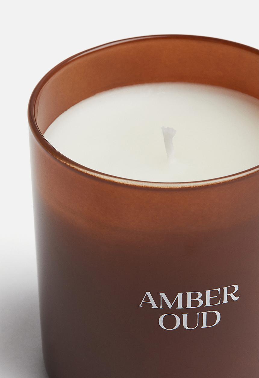 H&M - Scented candle in a glass holder - amber oud