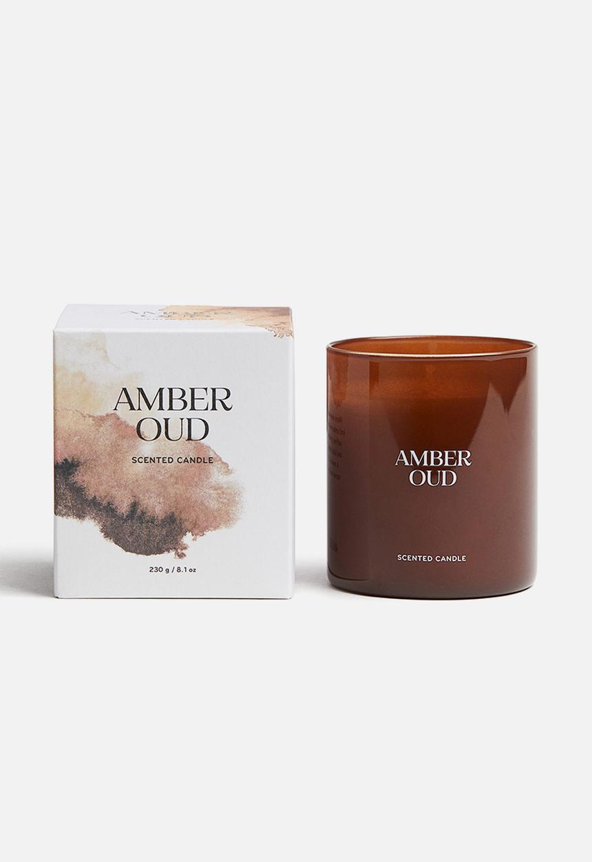 H&M - Scented candle in a glass holder - amber oud