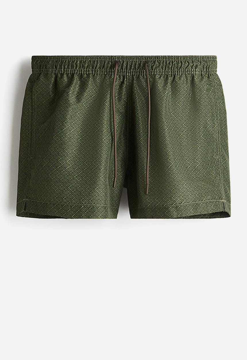 H&M - Patterned swim shorts - dark green patterned