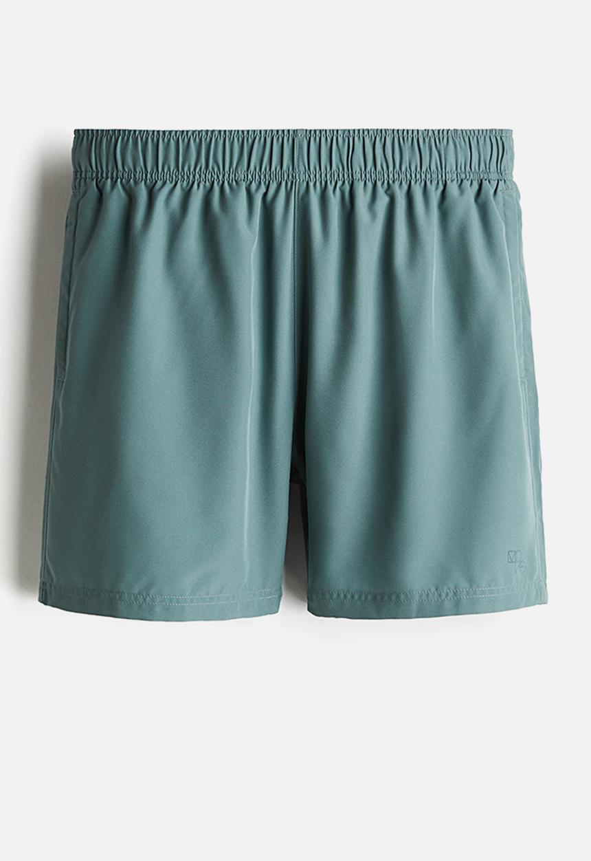 H&M - Mid-length sports shorts with drymove™ - turquoise