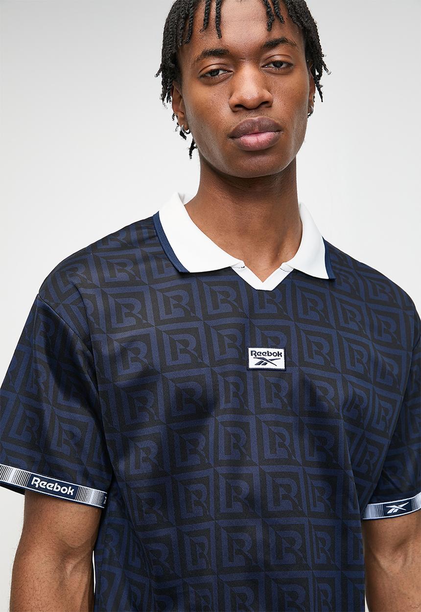 Reebok - Monogram Football Polo - Vector Navy Aop