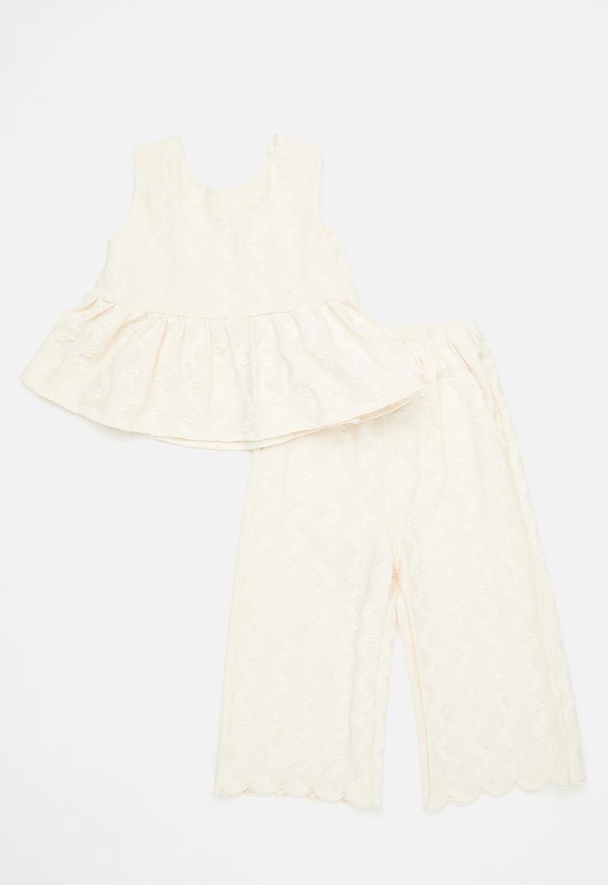 Pop Candy - Textured peplum top with bow feature & scallop hem pants - off white