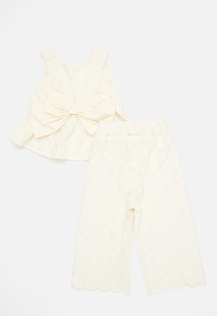 Pop Candy - Textured peplum top with bow feature & scallop hem pants - off white