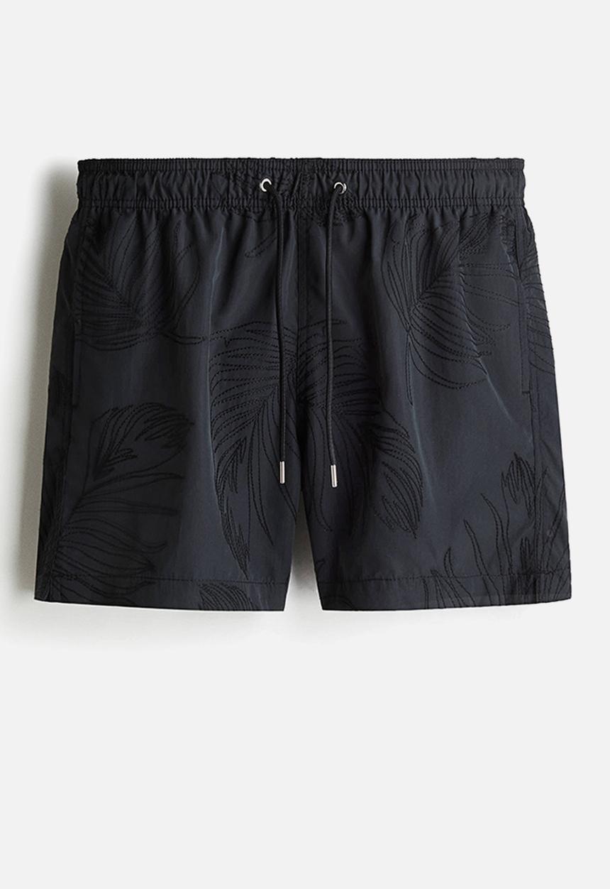 H&M - Patterned swim shorts - black leaf-patterned