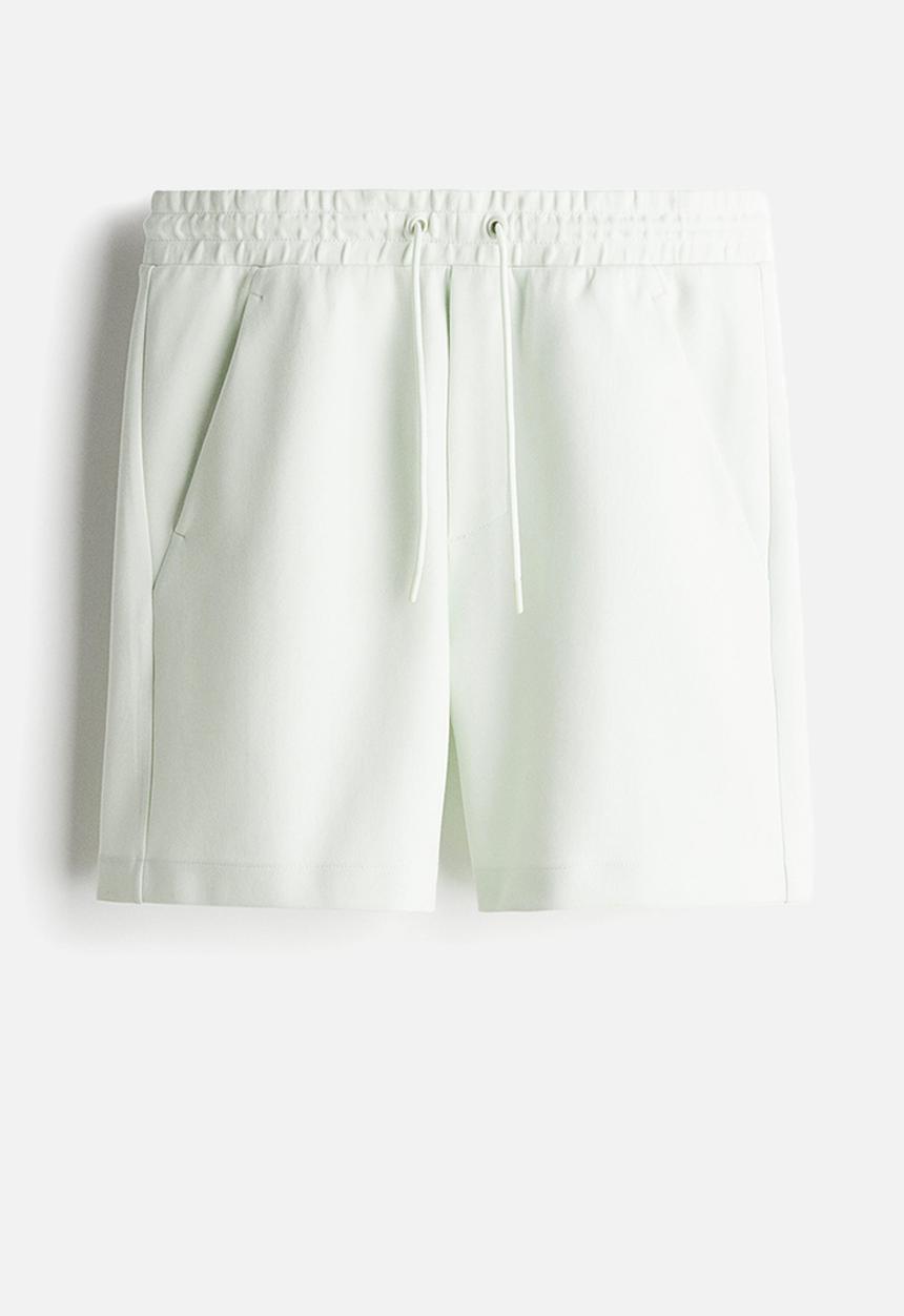 H&M - Regular fit sweatshorts - pale green 