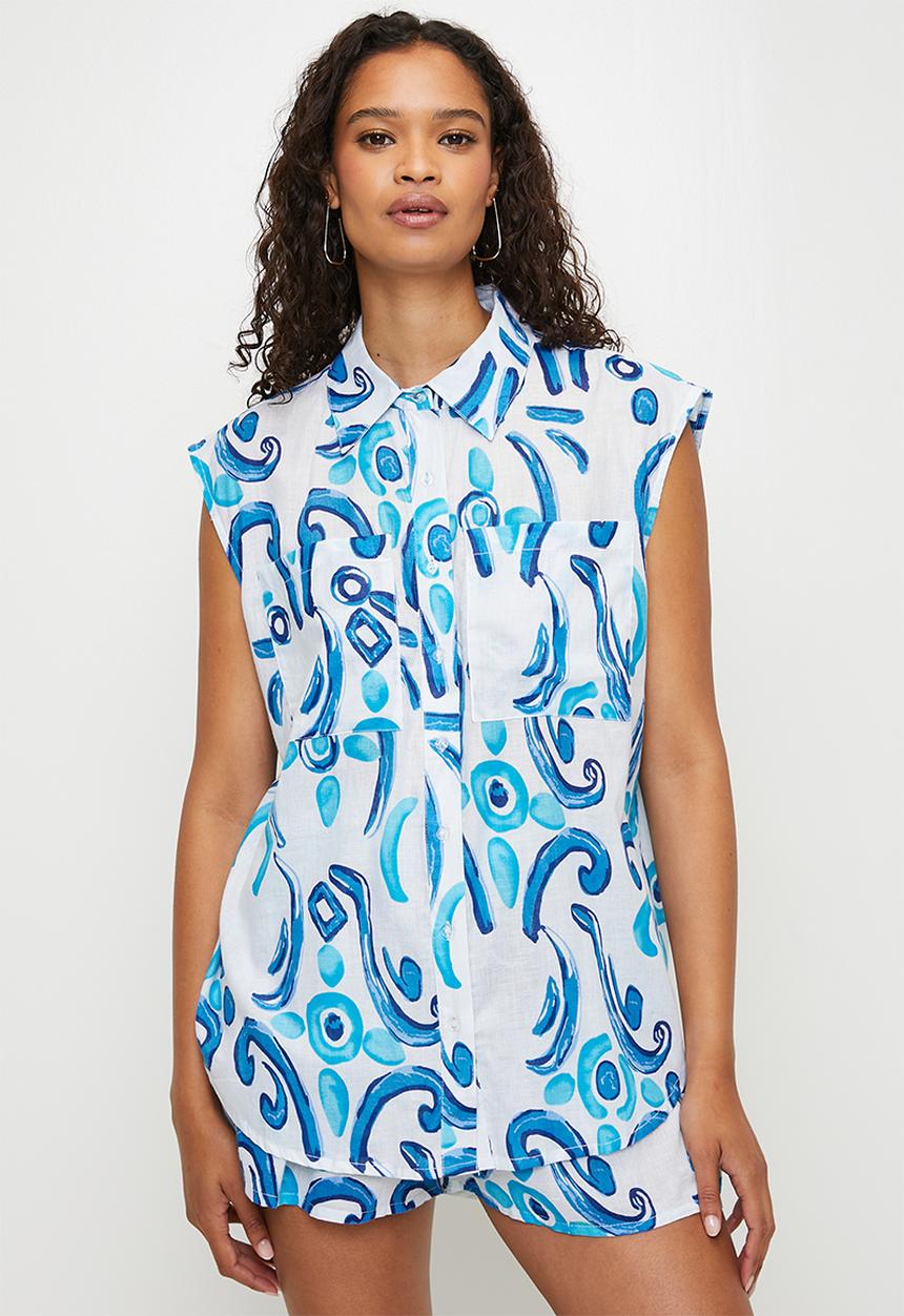 MANDI - Sleeveless Button Through Sheer Printed Blouse Longer Length - Blue
