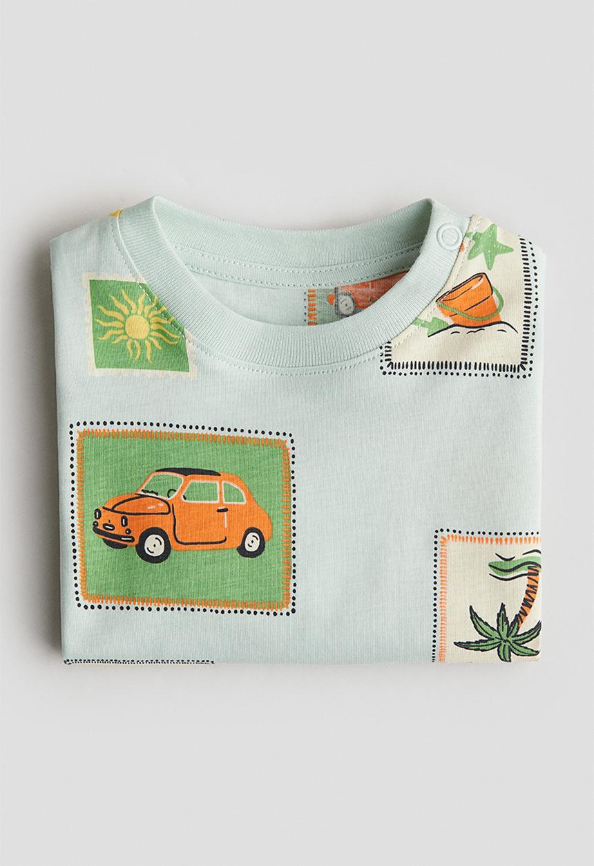 H&M - Printed cotton T-shirt - light turquoise/stamps
