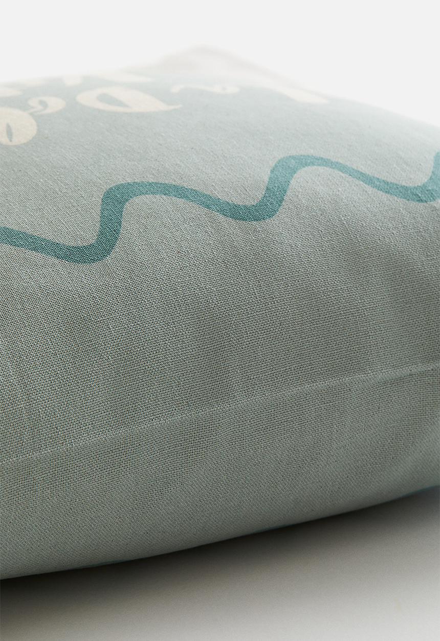 H&M - Printed cotton cushion cover - light turquoise/la dolce vita
