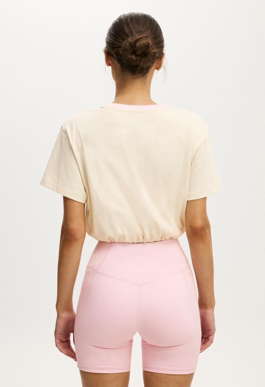Cotton On - Active Graphic Tie Up Tee - Coconut Milk/Sport Club