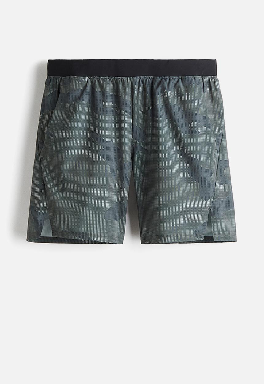 H&M - Mid-length sports shorts with drymove™ - dark green/patterned