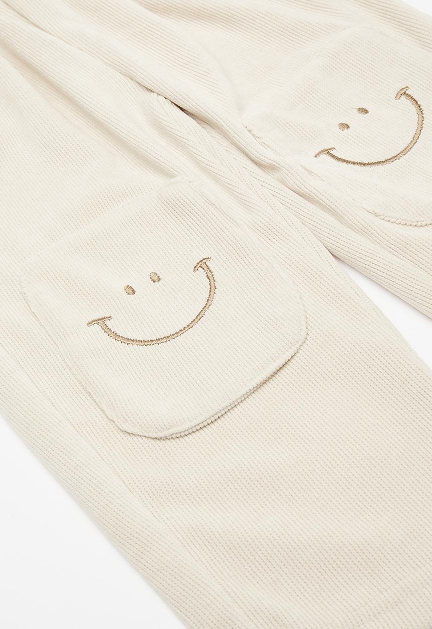 Pop Candy - Waffle knit pants with smiley face knee patches - ivory