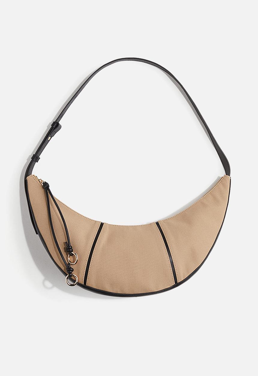 H&M - Curved shoulder bag - beige/black