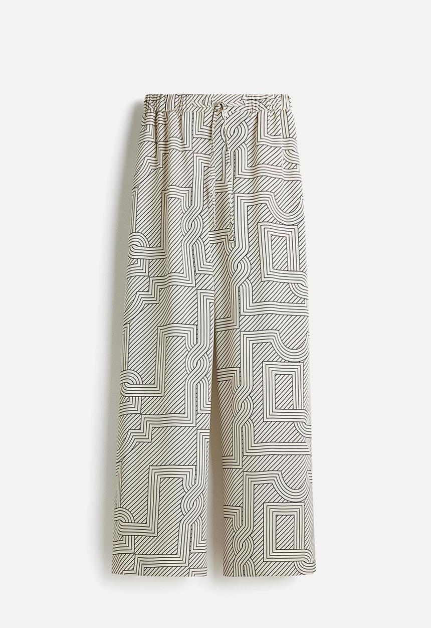 H&M - Wide trousers - cream patterned 