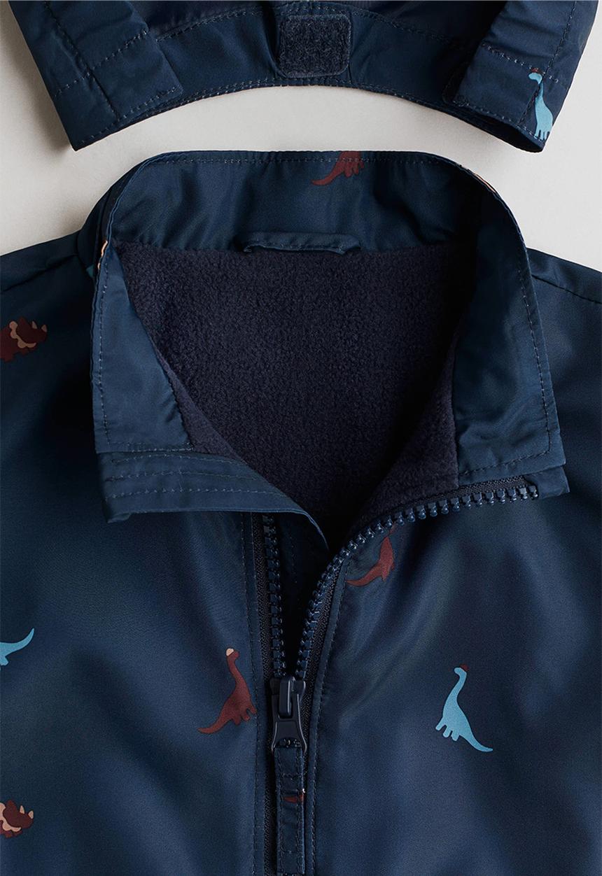H&M - Fleece-lined jacket - navy blue/dinosaurs