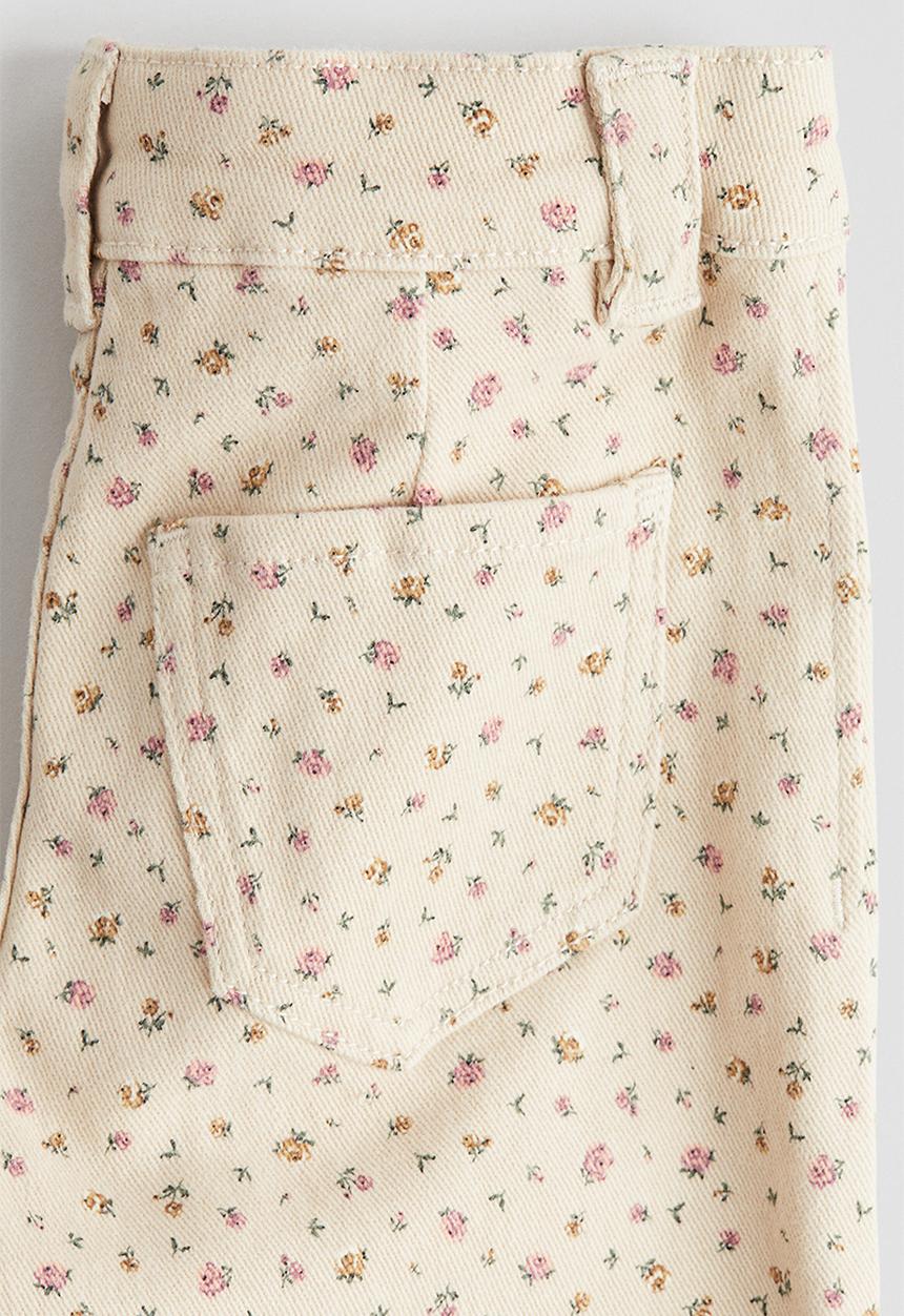 H&M - Flared leg jeans - light beige/floral