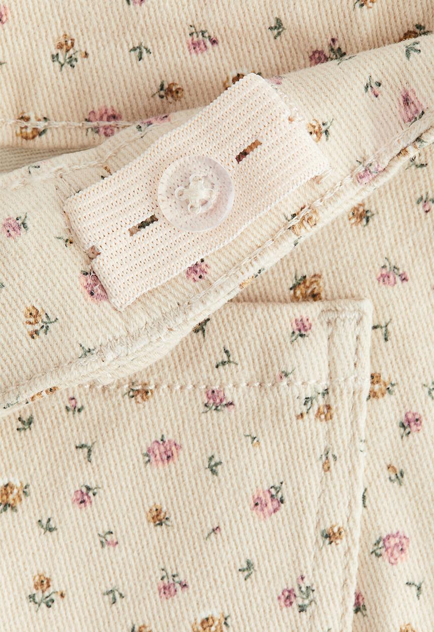 H&M - Flared leg jeans - light beige/floral