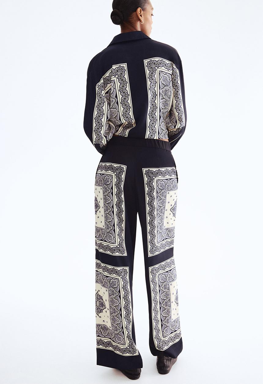 H&M - Straight trousers - navy blue/patterned 