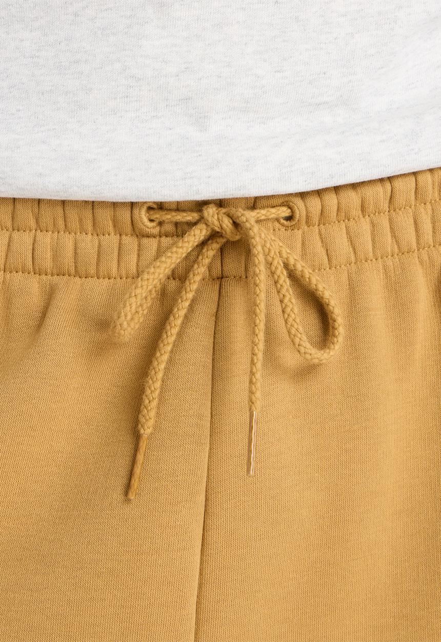 New Balance  - New Balance Linear Graphic Brushed Fleece Pant - Brown