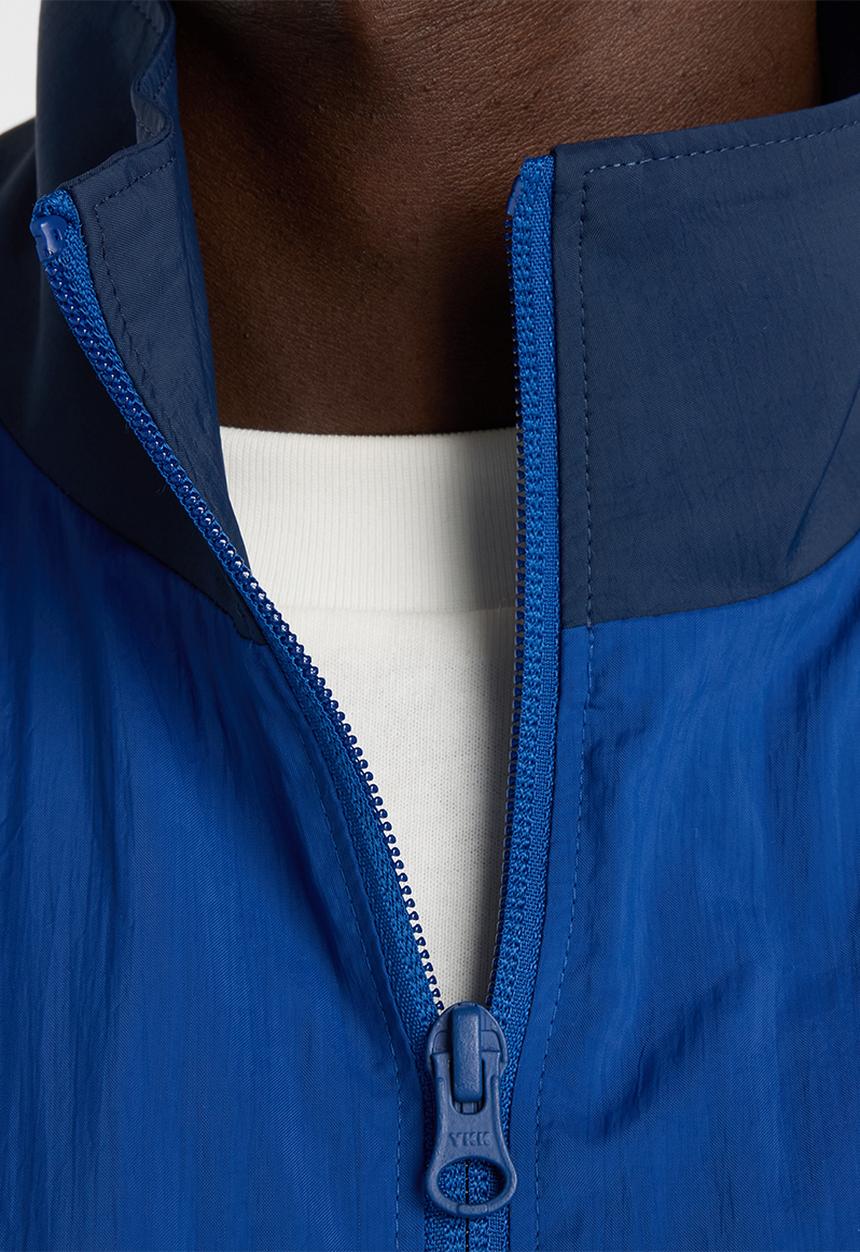 New Balance  - NB Athletics Sport Legacy Jacket - Blue