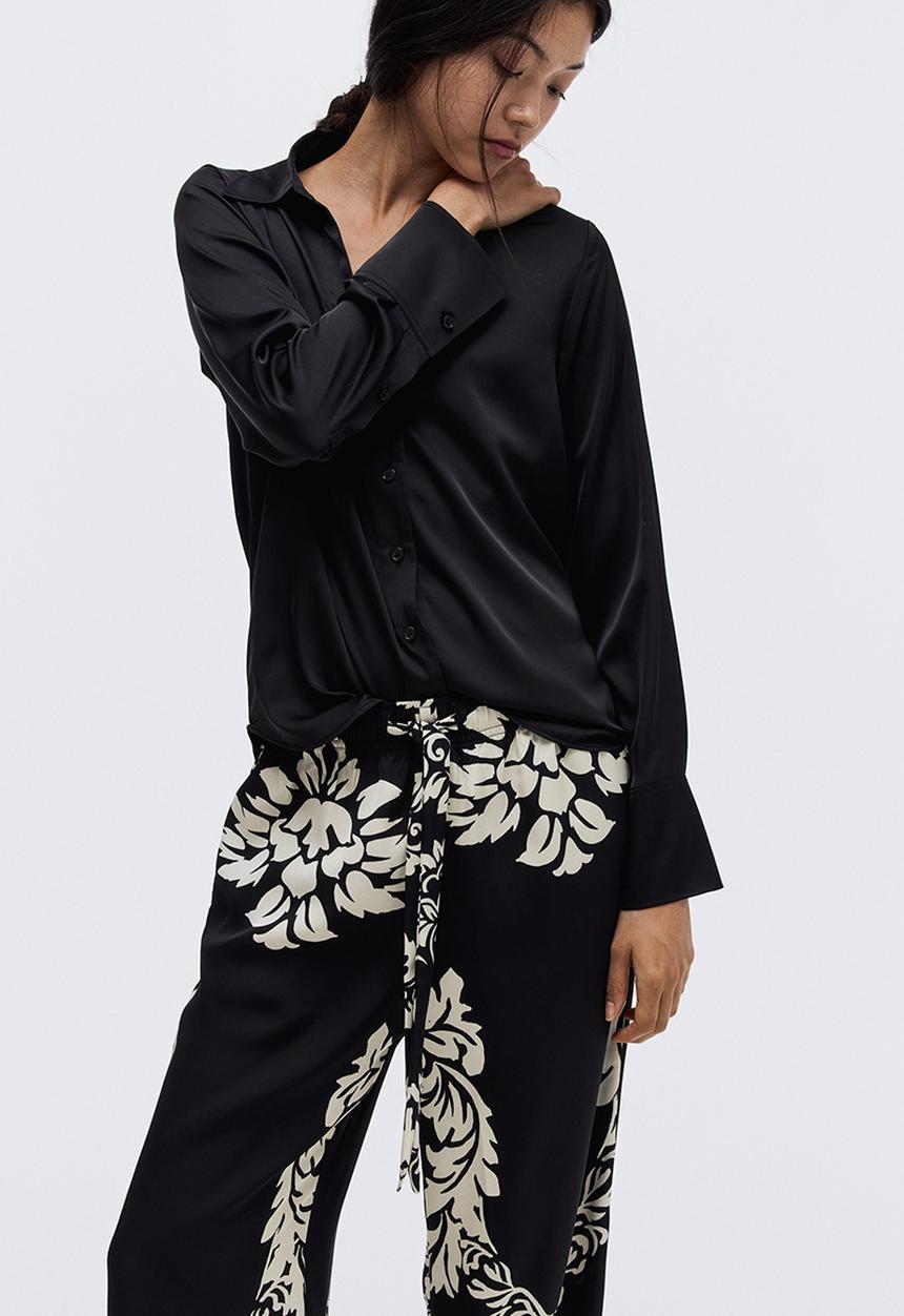 H&M - Wide trousers - black/patterned