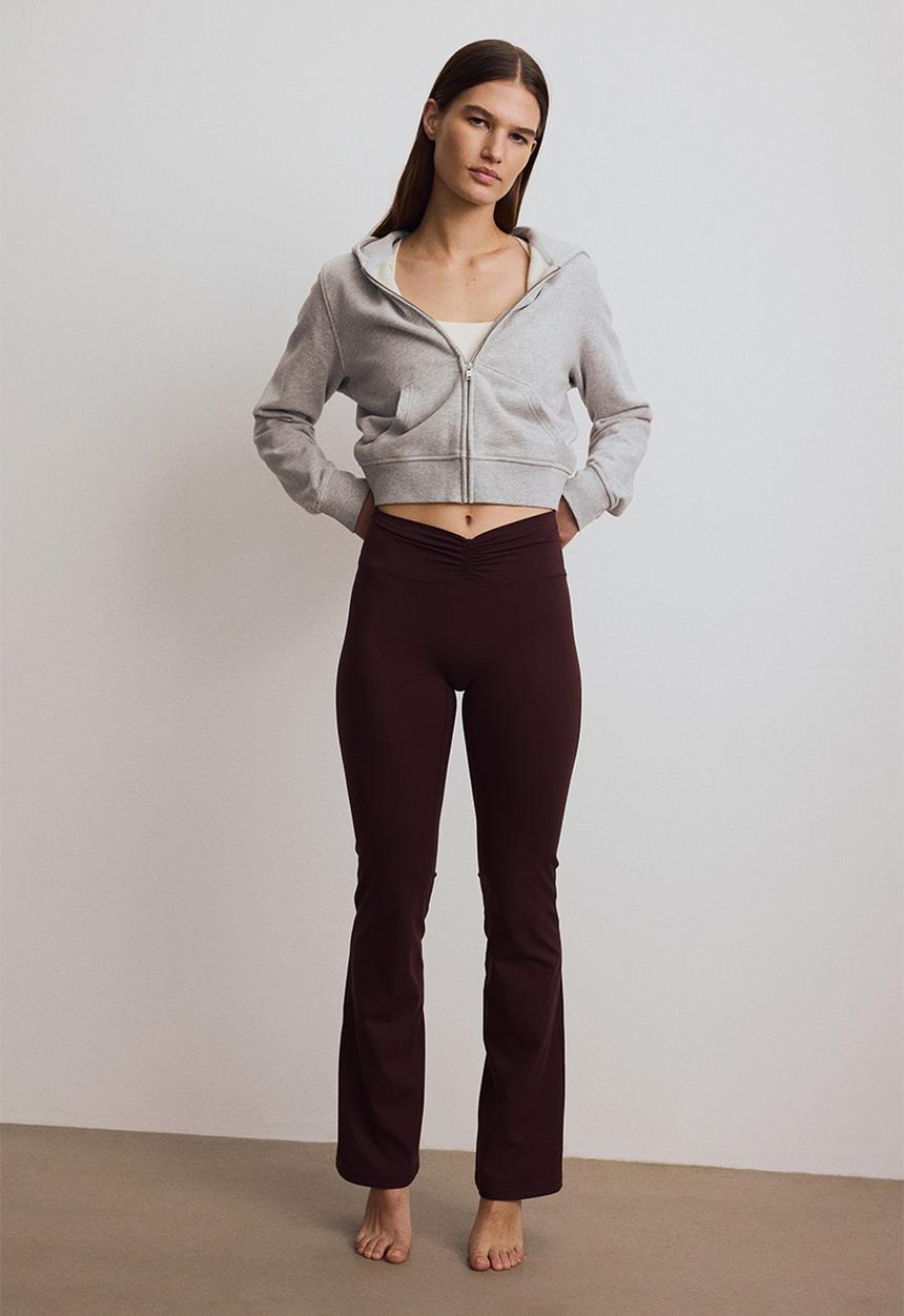 H&M - Flared yoga leggings with softmove? - chocolate plum purple