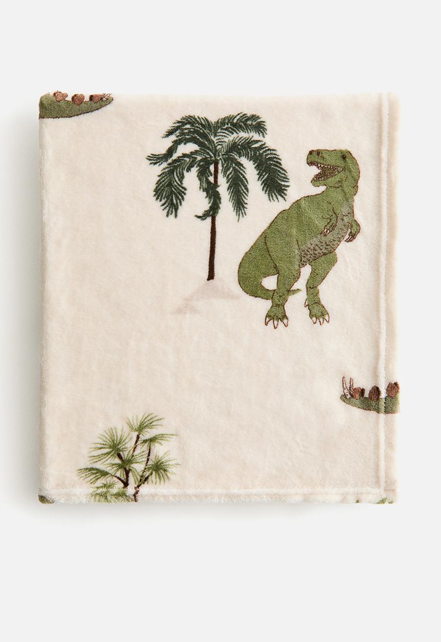 H&M - Patterned fleece blanket - light beige/dinosaurs