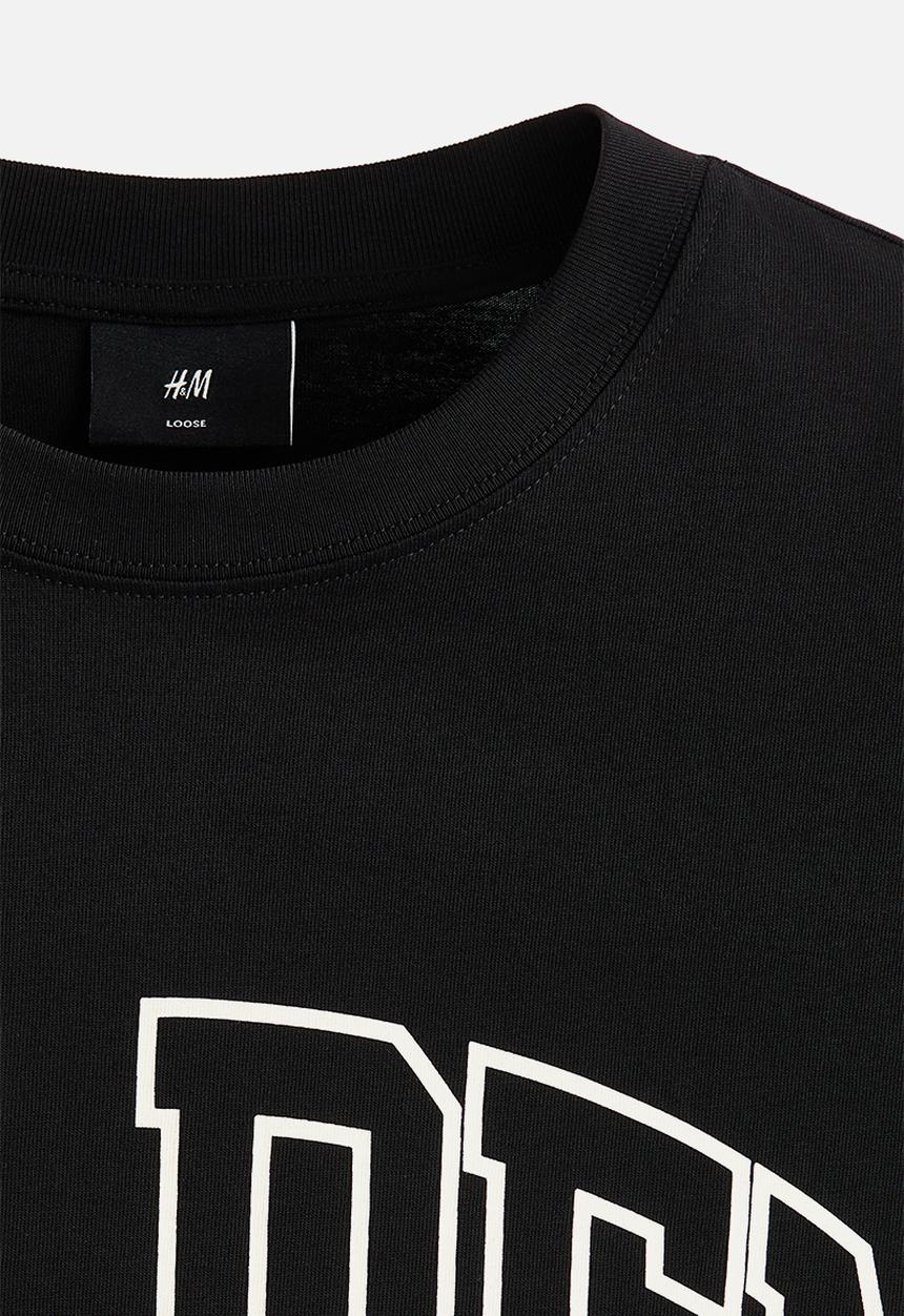 H&M - Loose fit printed t-shirt - black/golden sunset