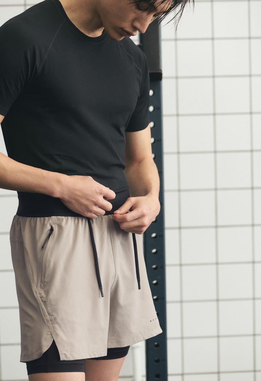 H&M - Double-layered sports shorts with drymove™ - beige/black
