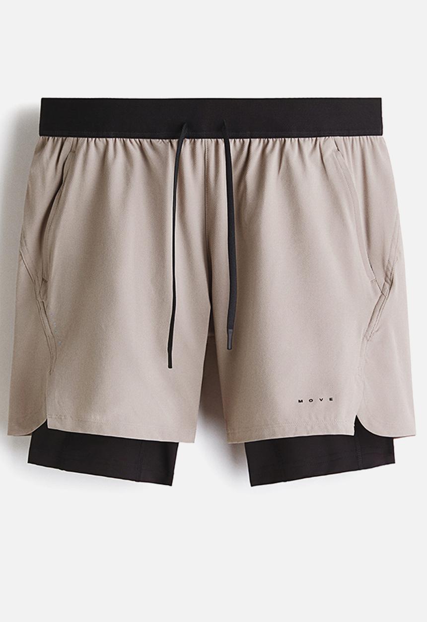 H&M - Double-layered sports shorts with drymove™ - beige/black