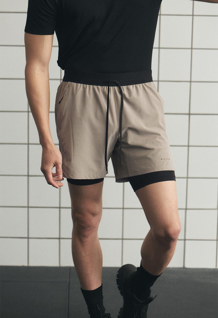 H&M - Double-layered sports shorts with drymove™ - beige/black