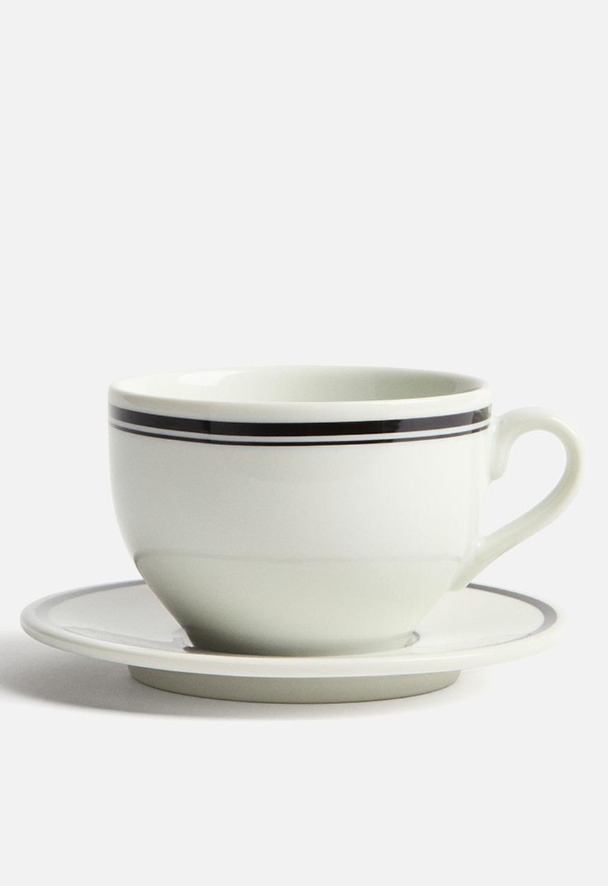 H&M - Porcelain cup and saucer - white/black