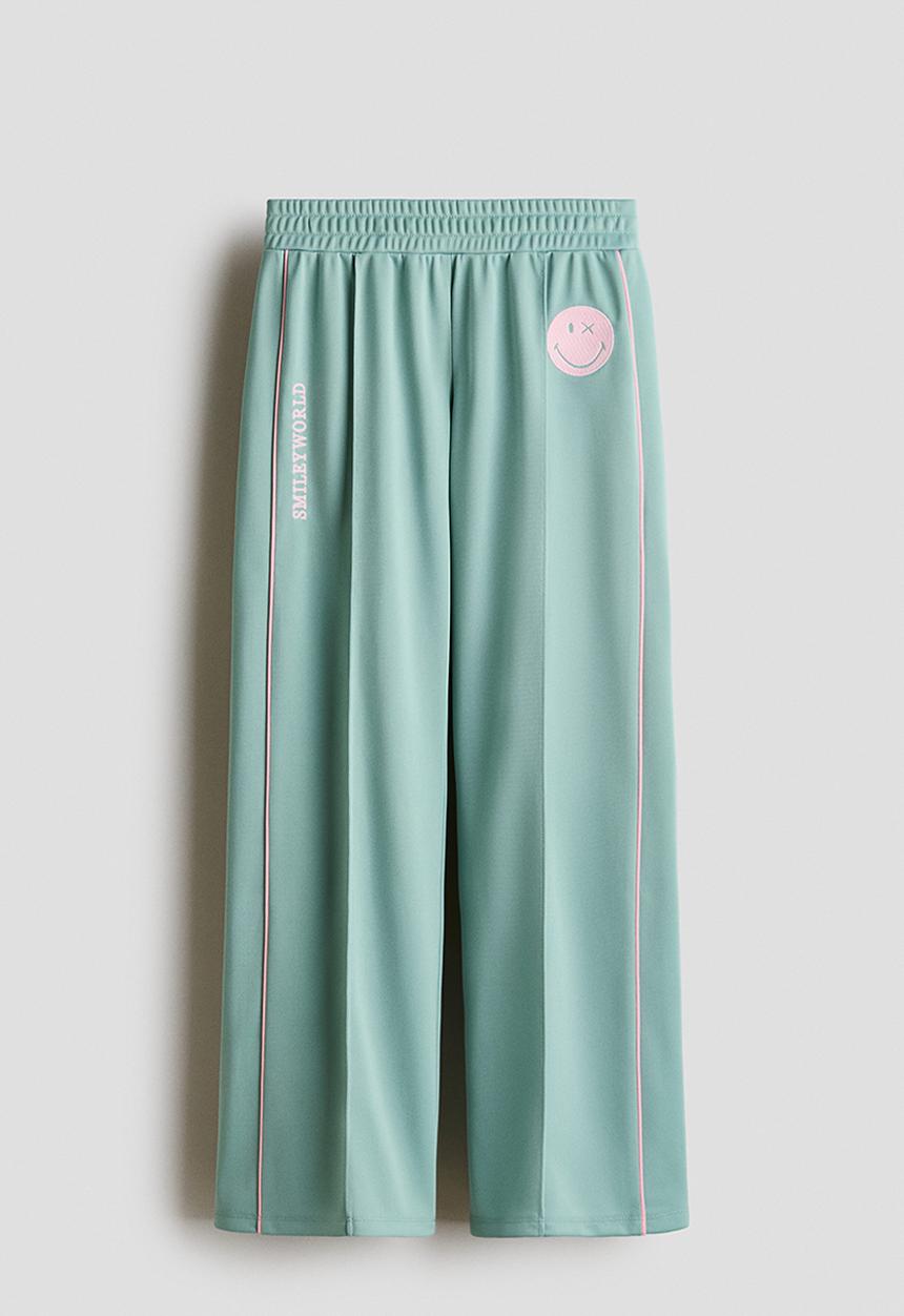 H&M - Wide-leg track pants - light green/smileyworld?