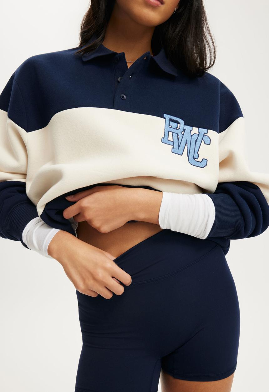 Cotton On - Plush Graphic Rugby Sweatshirt - Prep Sport Navy/Bwc