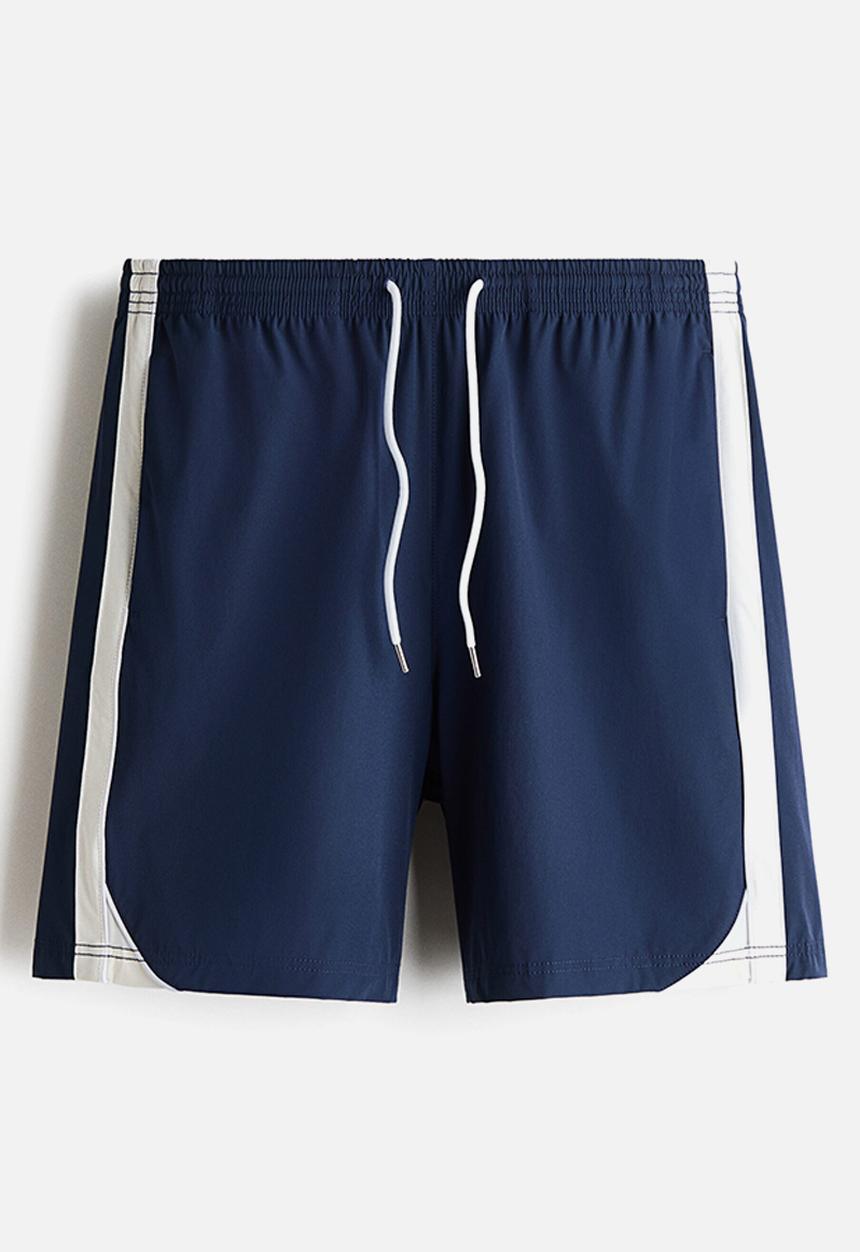 H&M - Regular fit track shorts - navy blue/white