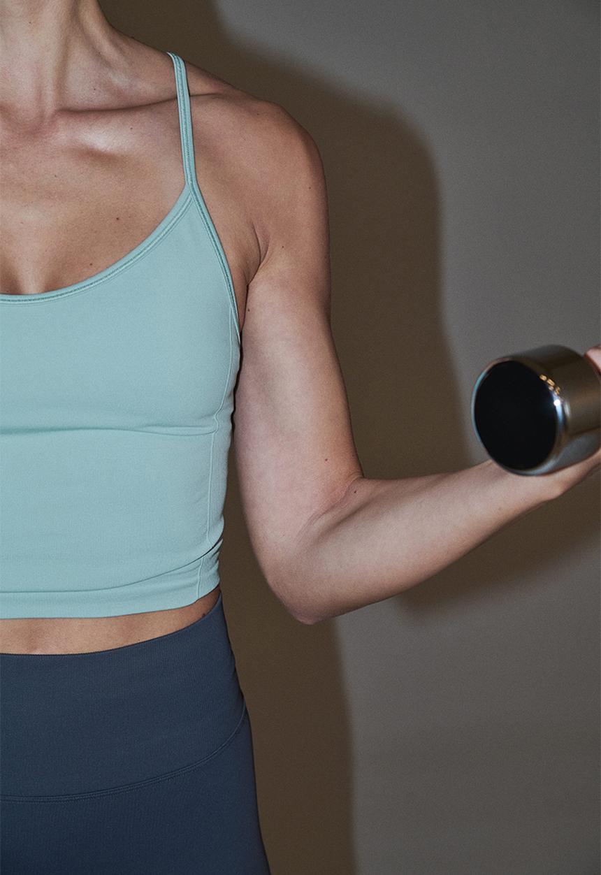 H&M - Seamless sports top with drymove - light turquoise