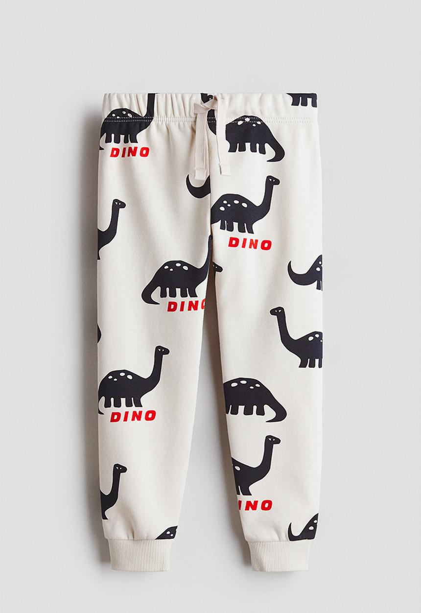 H&M - Printed joggers - light beige/dinosaurs