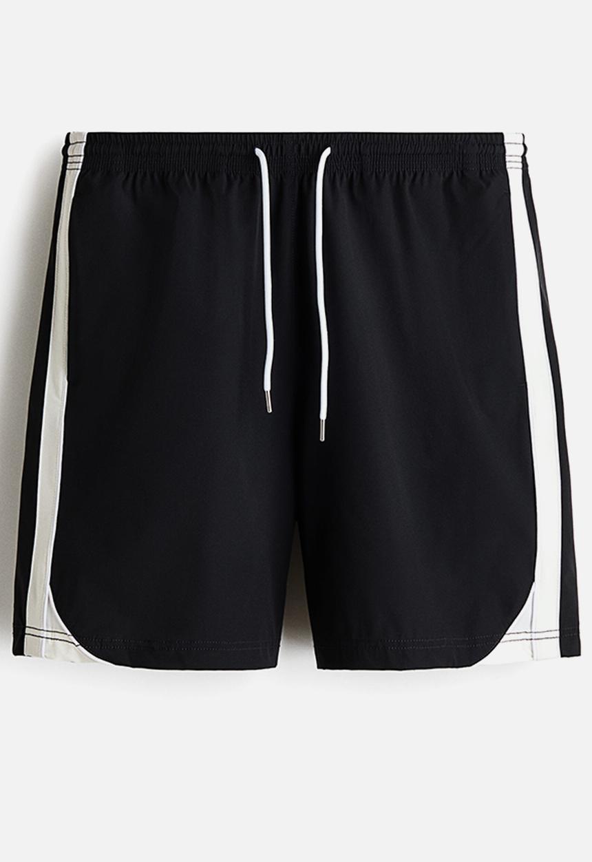 H&M - Regular fit track shorts - black/colour block
