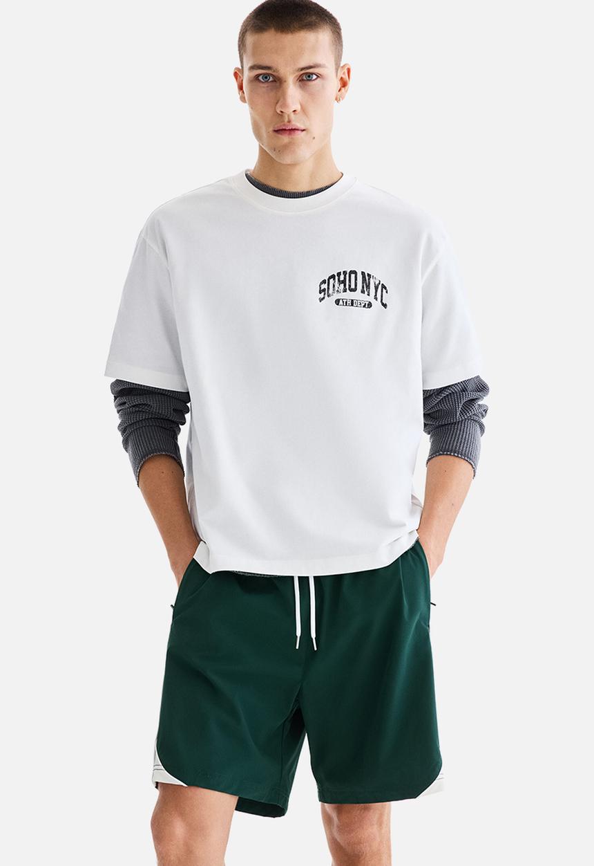 H&M - Regular fit track shorts - dark green/colour block