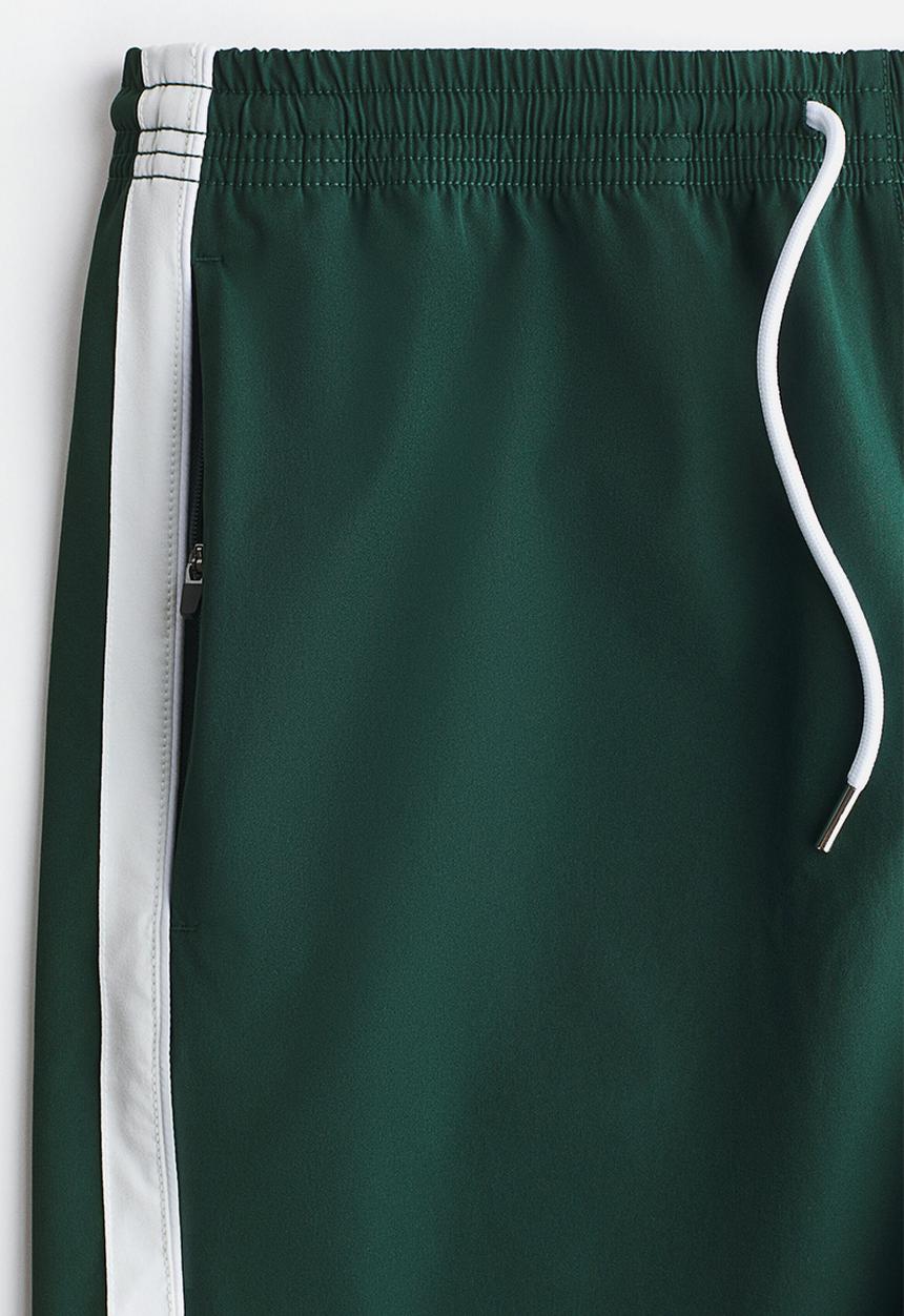 H&M - Regular fit track shorts - dark green/colour block