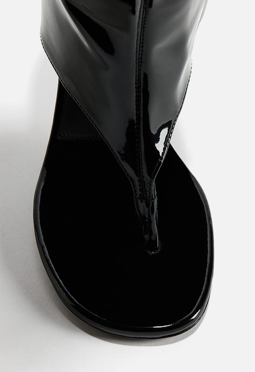 H&M - WARDROBE.NYC H&M:  Cut-out leather sock boots - black