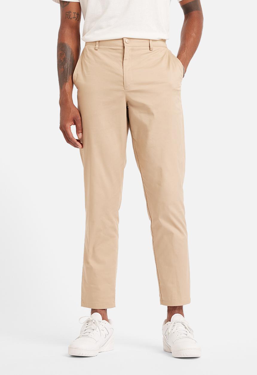 New Balance  - NB Athletics Tapered Pant - Brown