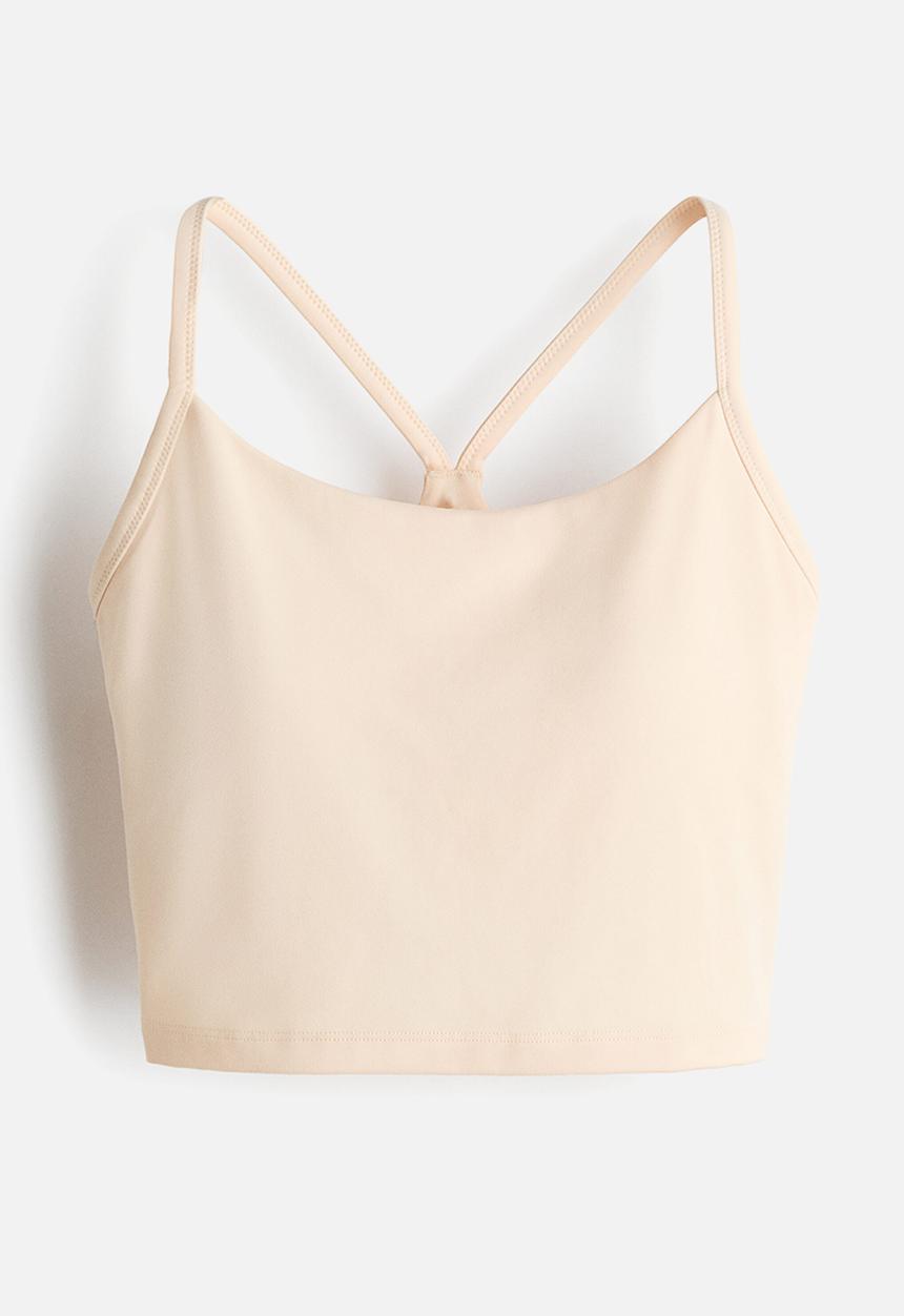 H&M - Medium support sports strappy top with softmove? - butter yellow