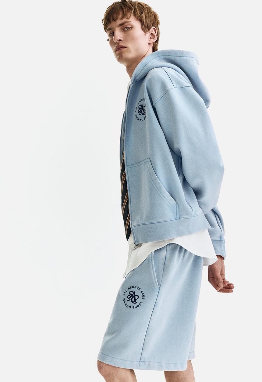 H&M - Relaxed fit shorts - light blue/all sports club