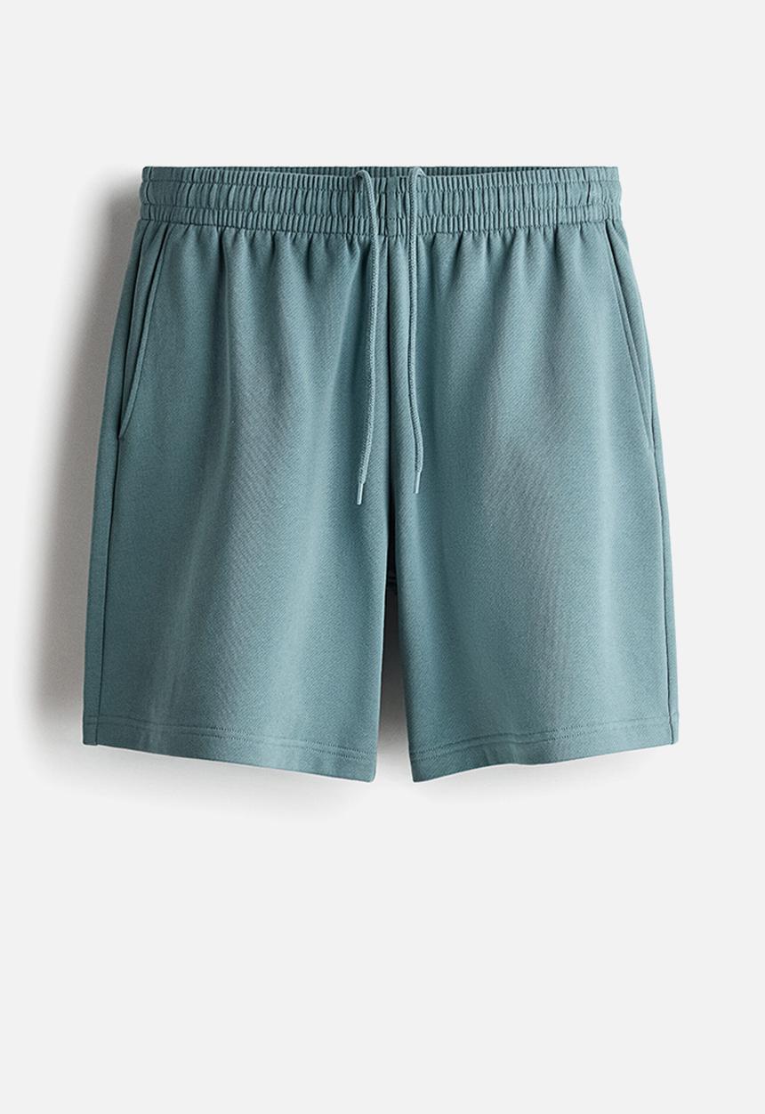 H&M - Regular fit sweatshorts - light dusty teal