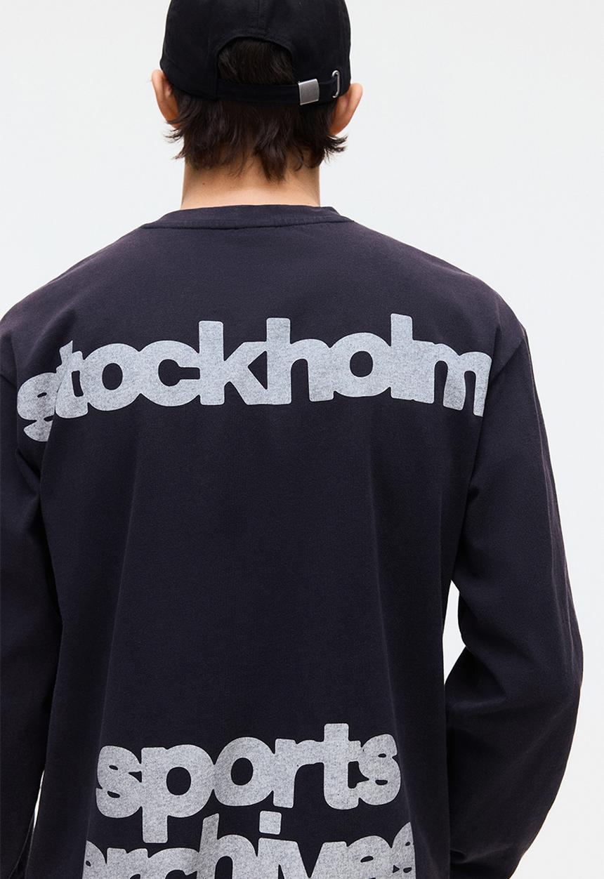H&M - Loose fit printed long-sleeved top - navy blue/sports archives