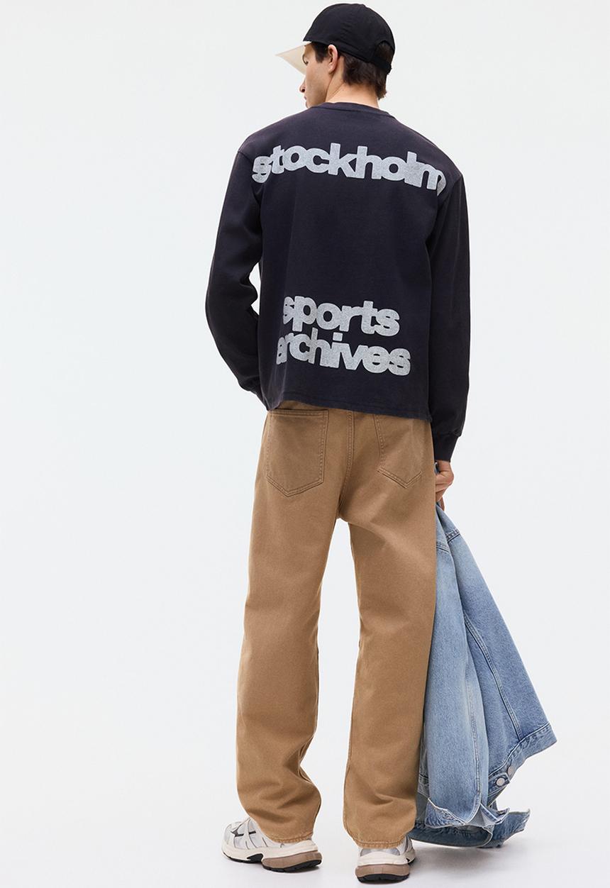 H&M - Loose fit printed long-sleeved top - navy blue/sports archives