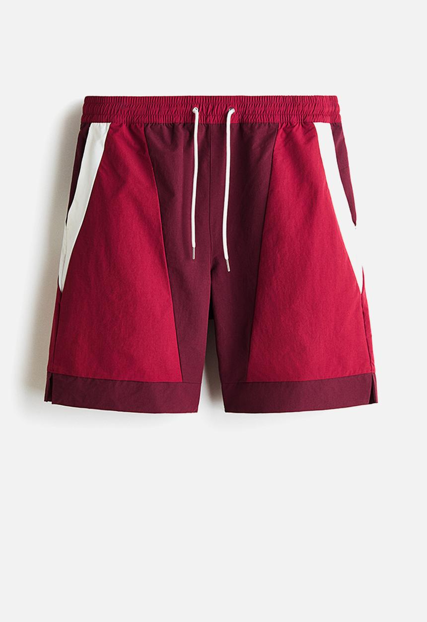 H&M - Loose fit track shorts - burgundy/colour block